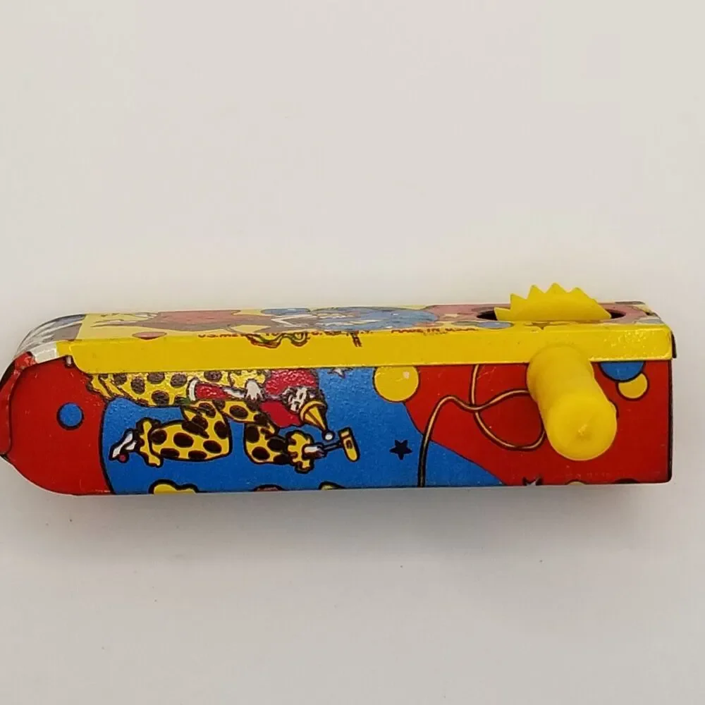vintage tin lithograph ratchet style US Metal Toy Co noisemaker party theme